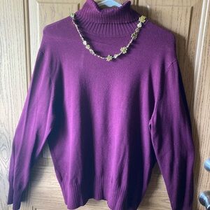 Thin purple turtle neck sweater.